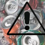 delle lattine e un segnale di allarme