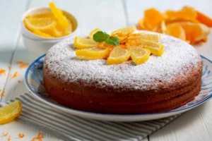 torta con sopra zucchero a velo e fettine di arancia