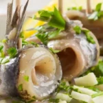 Involtini di alici ripieni con erbe aromatiche