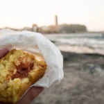 mangiare arancino al mare