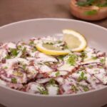 carpaccio di polpo con fette di limone